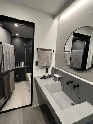 a bathroom with a sink and a mirror at Koenji Designer house 50m2, 5min to Shinjuku in Tokyo