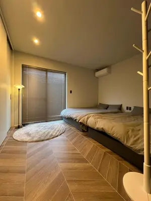 a bedroom with two beds and a window at Koenji Designer house 50m2, 5min to Shinjuku in Tokyo