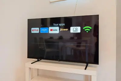 a flat screen tv sitting on top of a table at \u96f2 Yun \u5317\u5343\u4f4f\u8eca\u7ad9\u6b65\u884c11\u5206\u9418 \u76f4\u9054 Asakusa \u4e0a\u91ce \u79cb\u8449\u539f \u6674\u7a7a\u5854 \u65e5\u66ae\u91cc \u6d89\u8c37 \u8868\u53c3\u9053 \u6771\u4eac \u516d\u672c\u6728 \u9280\u5ea7 in Tokyo