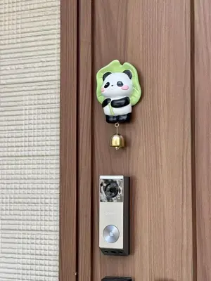 a door with a hello kitty sticker on it at 5 min to JR Tabata Station Entire 3BR House 82sqm Sleeps 5 Hot Tub Newly Built in Tokyo