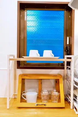 a table with bowls and dishes on top of it at Astra house in Tokyo