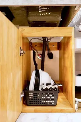 a cabinet with a kitchen appliance in it at Astra house in Tokyo