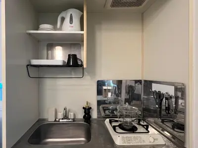 a kitchen with a sink and a stove at Kuro House - In the middle of Hiro, Omotesando, Roppongi in Tokyo