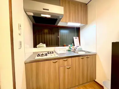 a small kitchen with a sink and a stove at Minami Shinagawa House \u5357\u54c1\u5dddHouse in Tokyo