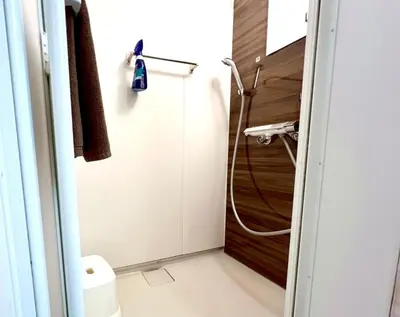 a bathroom with a shower and a toilet in it at Minami Shinagawa House \u5357\u54c1\u5dddHouse in Tokyo