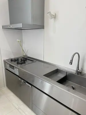 a kitchen with a sink and a stove at CIENtONCE BLD in Tokyo