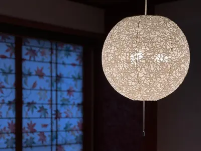 a orb light fixture hanging in a room with a window at \u6e0b\u8c37\u897f\u5ddd\u30d3\u30eb in Tokyo