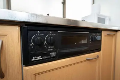 a microwave oven sitting on top of a kitchen counter at XS60 XROSS STAY Toyosu1 in Tokyo