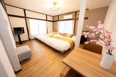 a bedroom with a bed and a tv in it at XS60 XROSS STAY Toyosu1 in Tokyo