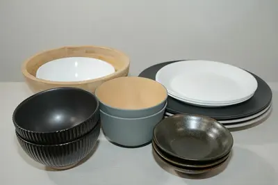 a group of bowls and plates on a table at INA HOUSE Koiwa 202 in Tokyo