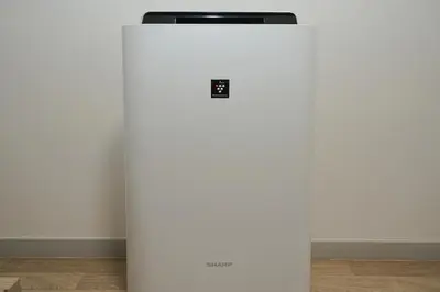 a white refrigerator sitting on the floor next to a wall at INA HOUSE Koiwa 202 in Tokyo
