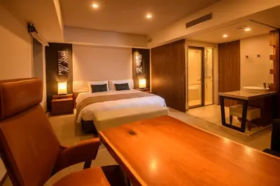 a hotel room with a bed and a desk at Tokyu Stay Ginza in Tokyo