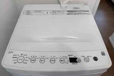 a close up of a white toilet with stickers on it at louis stage \u897f\u30f6\u539f 101\u5ba4 in Tokyo