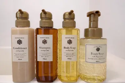 four bottles of essential oils lined up in a row at louis stage \u897f\u30f6\u539f 102\u5ba4 in Tokyo