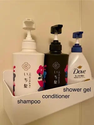 a shelf with two bottles of soap and shampoo at west16 in Tokyo