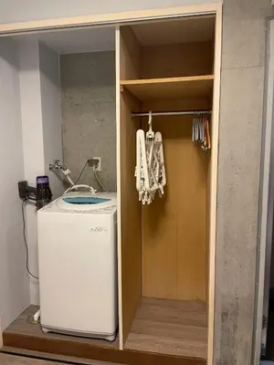 a bathroom with a sink and a washing machine at west16 in Tokyo