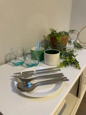 a table with a white plate with silverware and glasses at west16 in Tokyo