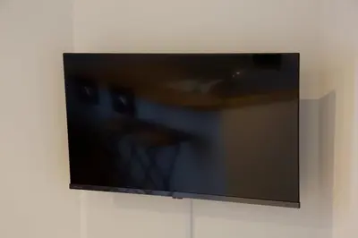 a flat screen tv hanging on a wall at FelizLife \u5357\u99ac\u8fbc 201 in Tokyo