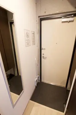 a bathroom with a door and a mirror at FelizLife \u5357\u99ac\u8fbc 201 in Tokyo