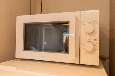 a microwave oven sitting on top of a shelf at Mi-Hotel Asakusa Senso-ji in Tokyo