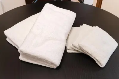 a pair of white towels sitting on a table at Shibuya Hotel 502 in Tokyo