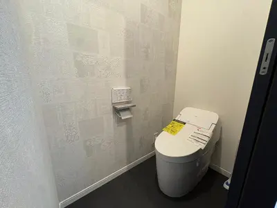 a small bathroom with a toilet in a stall at COTO Premium Kyodo in Tokyo