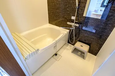 a bathroom with a bath tub and a shower at F-City \u4e2d\u845b\u897f iii in Tokyo