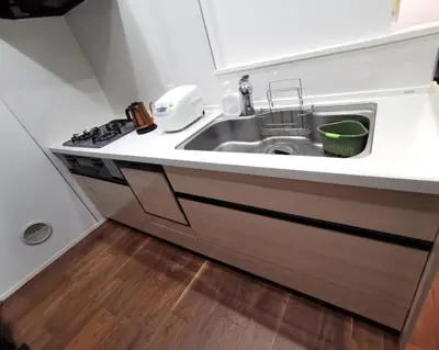 a kitchen with a sink and a stove at Private Hotel Skytree Garden in Tokyo