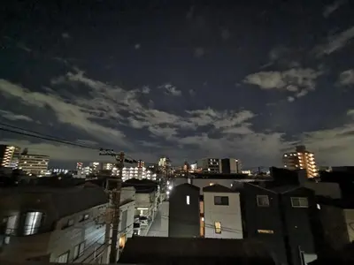 a view of a city at night with buildings at Private Hotel Skytree Garden in Tokyo