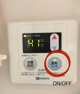 a digital clock on a white appliance with a red ring at \u677e\u4e43\u7af9102 in Tokyo