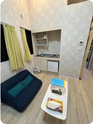 a living room with a couch and a table at \u677e\u4e43\u7af9102 in Tokyo