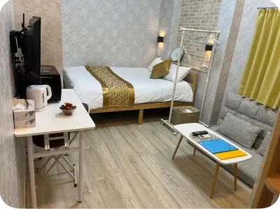 a small room with a bed and a desk and a tv at \u677e\u4e43\u7af9102 in Tokyo