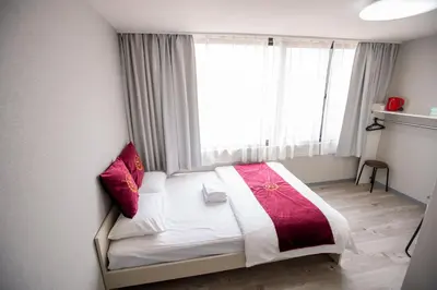 a bed in a room with a large window at Asakusabashi MY Hostel max2 people-TT0495 in Tokyo