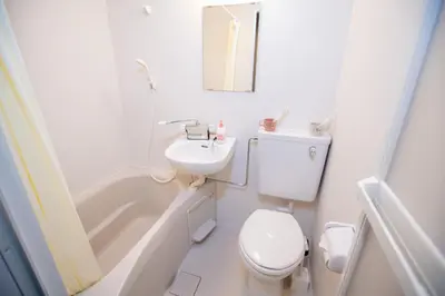 a white bathroom with a toilet and a sink at Asakusabashi MY Hostel max2 people-TT0495 in Tokyo