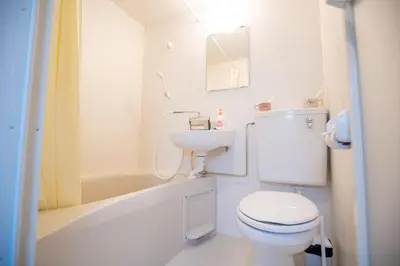 a bathroom with a toilet and a sink and a tub at Asakusabashi MY Hostel max2 people-TT0495 in Tokyo