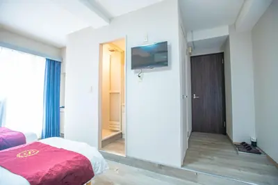 a bedroom with a mirror and a bed and a tv at Asakusabashi MY Hostel-max3 people-TT0509 in Tokyo