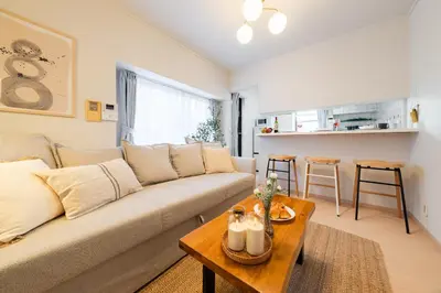 a living room with a couch and a table at Higashimukoujima Stay in Tokyo