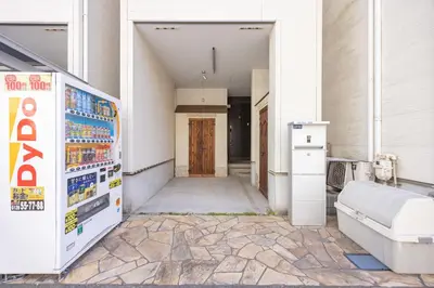 an empty hallway with a door in a building at Shinjuku Private Family House in Tokyo