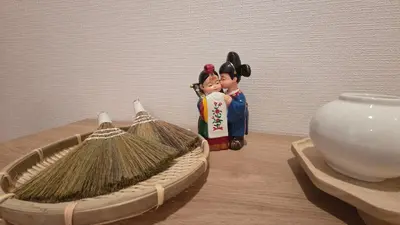 a figurine of two people standing next to a bowl at Nakano OSHIYO House in Tokyo