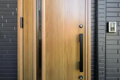 a wooden door on the side of a building at Chill Place 120 Ayase in Tokyo