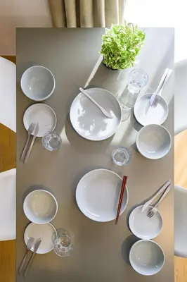 a table with white plates and silverware on it at Chill Place 120 Ayase in Tokyo