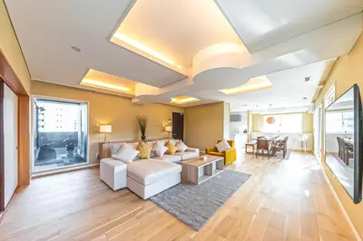 a living room with a couch and a table at Penthouse Ueno in Tokyo