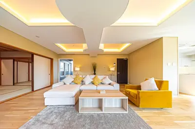 a living room with a couch and a table at Penthouse Ueno in Tokyo