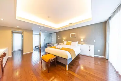 a bedroom with a large bed in a room at Penthouse Ueno in Tokyo
