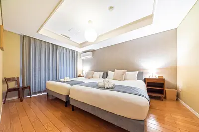 a bedroom with a large bed in a room at Penthouse Ueno in Tokyo
