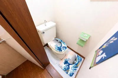 a small bathroom with a toilet and a sink at 1200IN&OUT 5people 35m2 2Queenbed! 1sofabed! Exclusive house Shinjuku 18 minutes Shibuya 22 minutesIkebukuro 11 minutes in Tokyo