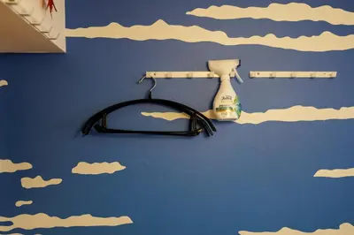 a wall with clouds painted on it with a hair dryer at WhiteCourt206 in Tokyo