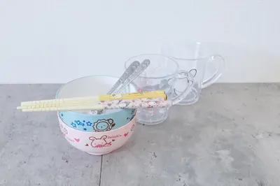 two measuring cups and chopsticks in a bowl with chopsticks at WhiteCourt206 in Tokyo