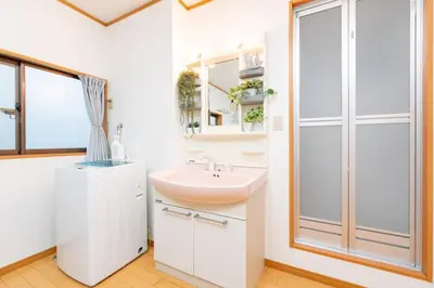 a bathroom with a sink and a shower at 101 Tokyo Ikebukuro apartment near Pokemon Center in Tokyo