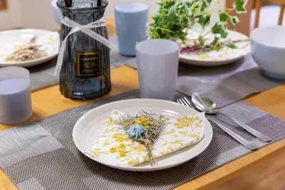 a table with white plates with flowers on it at 101 Tokyo Ikebukuro apartment near Pokemon Center in Tokyo
